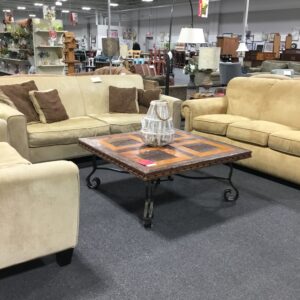 Tan Couch with 4 Brown Pillows